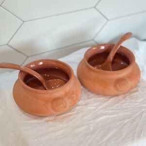 Terracotta salsa and guacamole serving dish with spoon